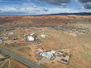 Aerial view of property and surrounding area featuring rural landscape and a desert landscape