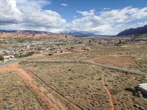 Overview of rural landscape with a mountain backdrop and a desert landscape