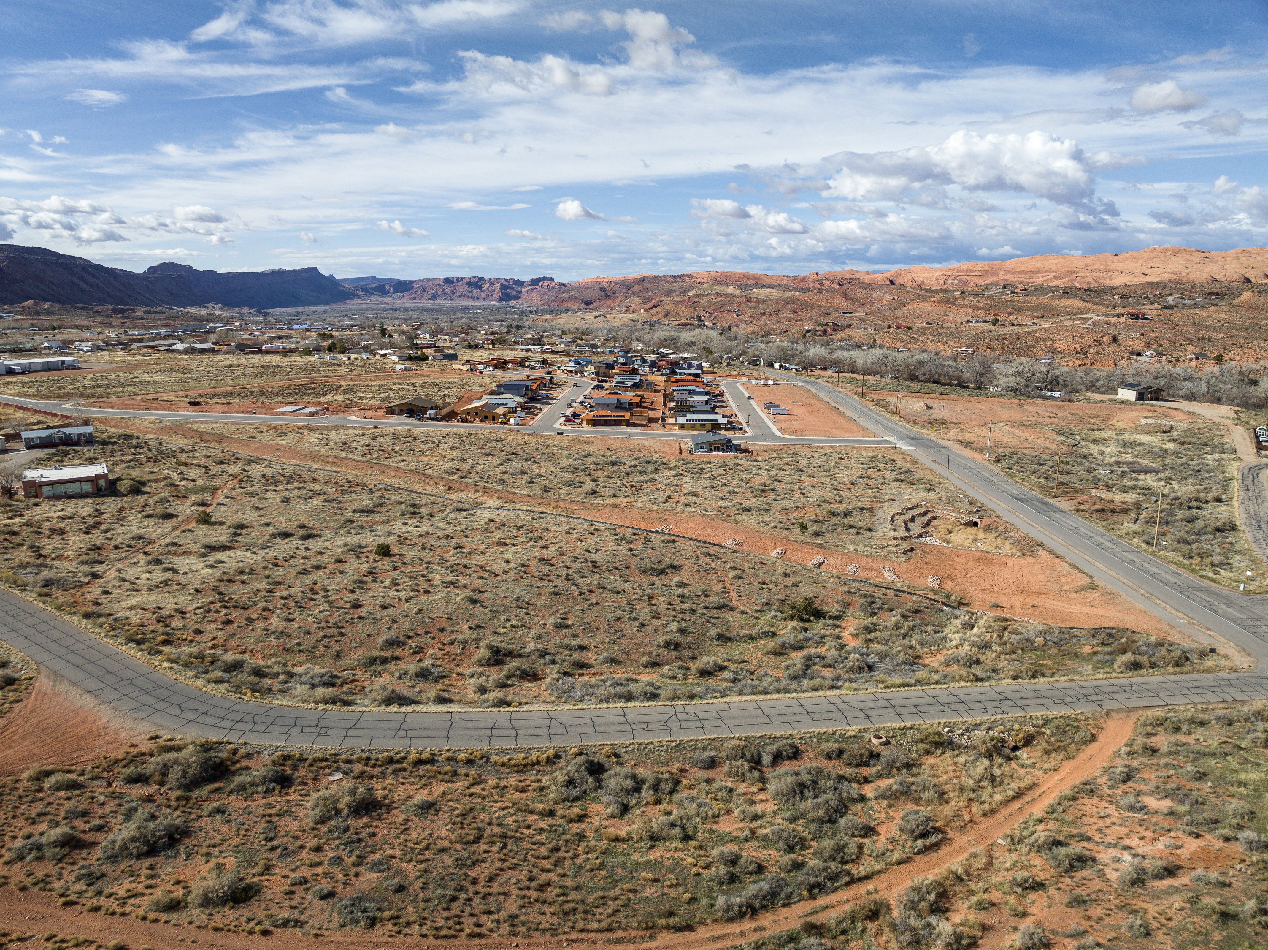 View of rural area with a desert landscape and a mountain backdrop