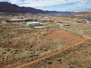 Aerial view of property and surrounding area with a mountain backdrop and rural landscape