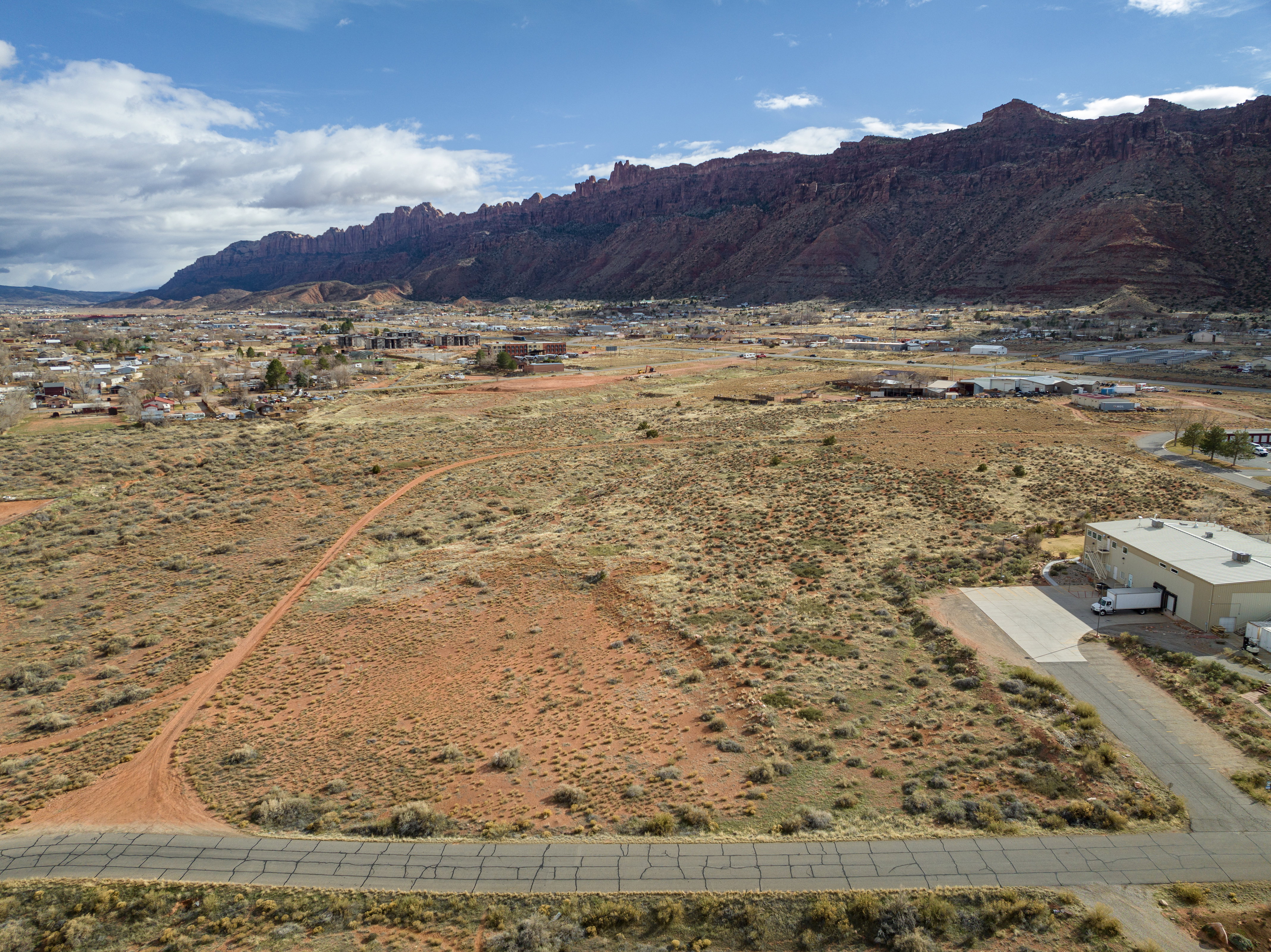 View of mountain backdrop with rural landscape and a desert landscape