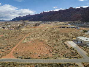 View of mountain backdrop with rural landscape and a desert landscape