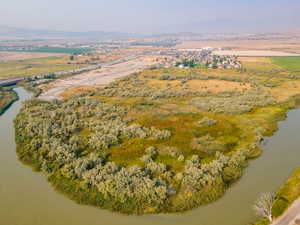 Aerial view of property's location featuring a nearby body of water and rural landscape