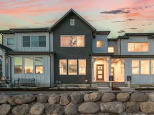 Back of property featuring board and batten siding