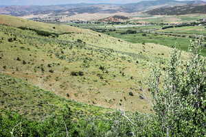 Aerial view of property's location featuring rural landscape and a mountain backdrop