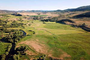 Aerial view of property's location with mountains.