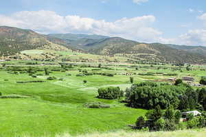 View of mountain background featuring rural landscape