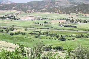 View of mountain background featuring rural landscape