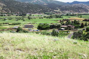 View of mountain background featuring rural landscape