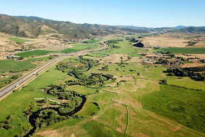 Aerial view of property's location with mountains.