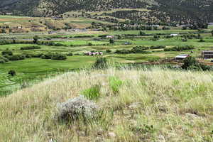 View of mountain backdrop featuring rural landscape