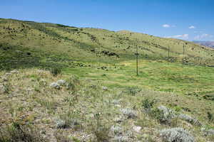View of mountain background featuring rural landscape