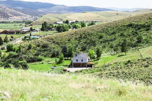 View of mountain background featuring rural landscape