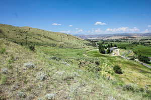 View of mountain background featuring rural landscape