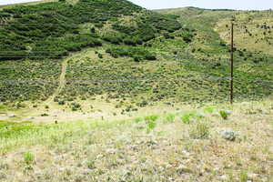 View of mountain background featuring rural landscape
