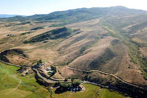 View of property location with a mountain backdrop and rural landscape