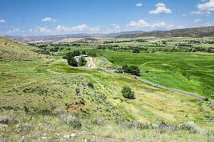 Aerial view of property and surrounding area with mountains and rural landscape