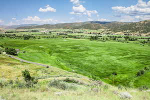 View of mountain background featuring rural landscape
