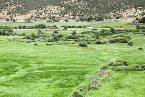 View of mountain backdrop featuring rural landscape