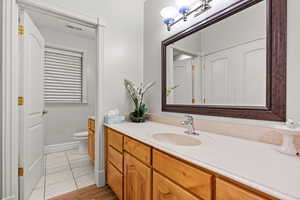 Bathroom featuring vanity and tile patterned floors