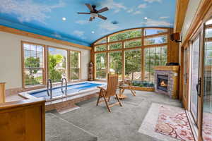 Sunroom with vaulted ceiling and a jacuzzi
