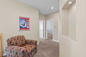 Living area featuring carpet and recessed lighting