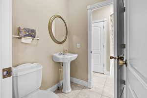 Half bath featuring tile patterned floors