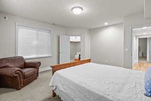 Bedroom with recessed lighting and light colored carpet