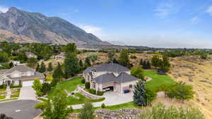View from above of property with a mountain backdrop