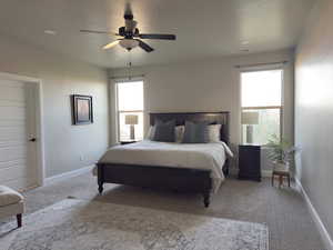 Bedroom with carpet flooring, ceiling fan, recessed lighting, and a textured ceiling