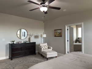 Carpeted bedroom with baseboards and a ceiling fan
