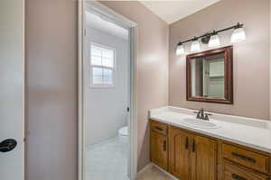 Bathroom with toilet and vanity