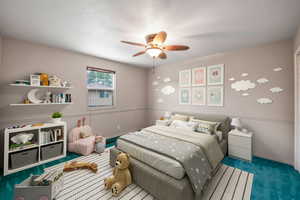 Bedroom with carpet floors, a ceiling fan, and a textured ceiling