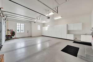 Garage featuring baseboards