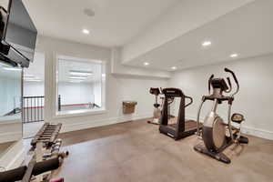 Workout room with baseboards and recessed lighting