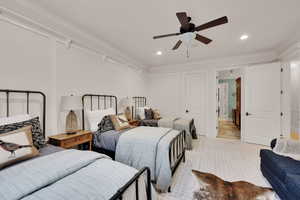 Bedroom featuring crown molding, light colored carpet, recessed lighting, and a ceiling fan
