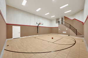 View of sport court featuring basketball hoop