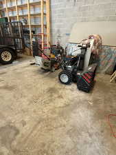 Garage featuring concrete block wall