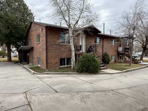 View of side of property with brick siding