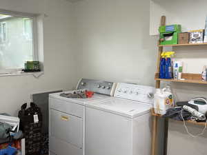 Laundry room featuring washing machine and clothes dryer