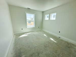 Unfurnished room with baseboards