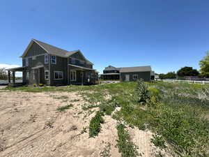 Rear view of house with board and batten siding