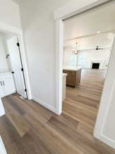 Open-concept living space with wood-finish flooring throughout