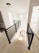 Staircase featuring plenty of natural light