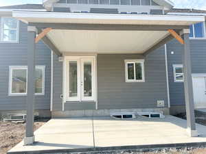 Entrance to property featuring covered porch