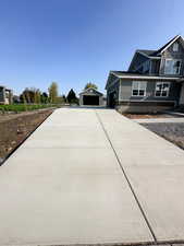 View of home's exterior with an outdoor structure and a garage