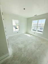 Unfurnished room featuring baseboards