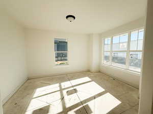 Spare room featuring baseboards