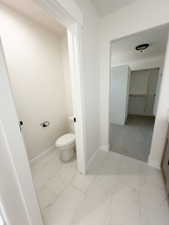 Porcelain tile flooring with veining detail throughout the space
