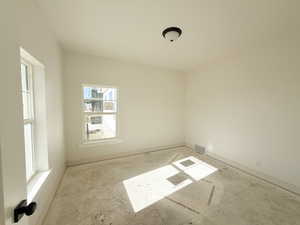 Empty room featuring baseboards